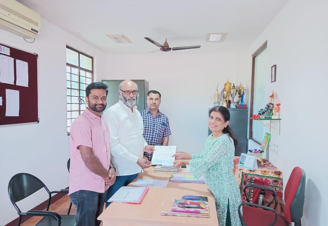 The trust's founder at the office during a partnership document handover